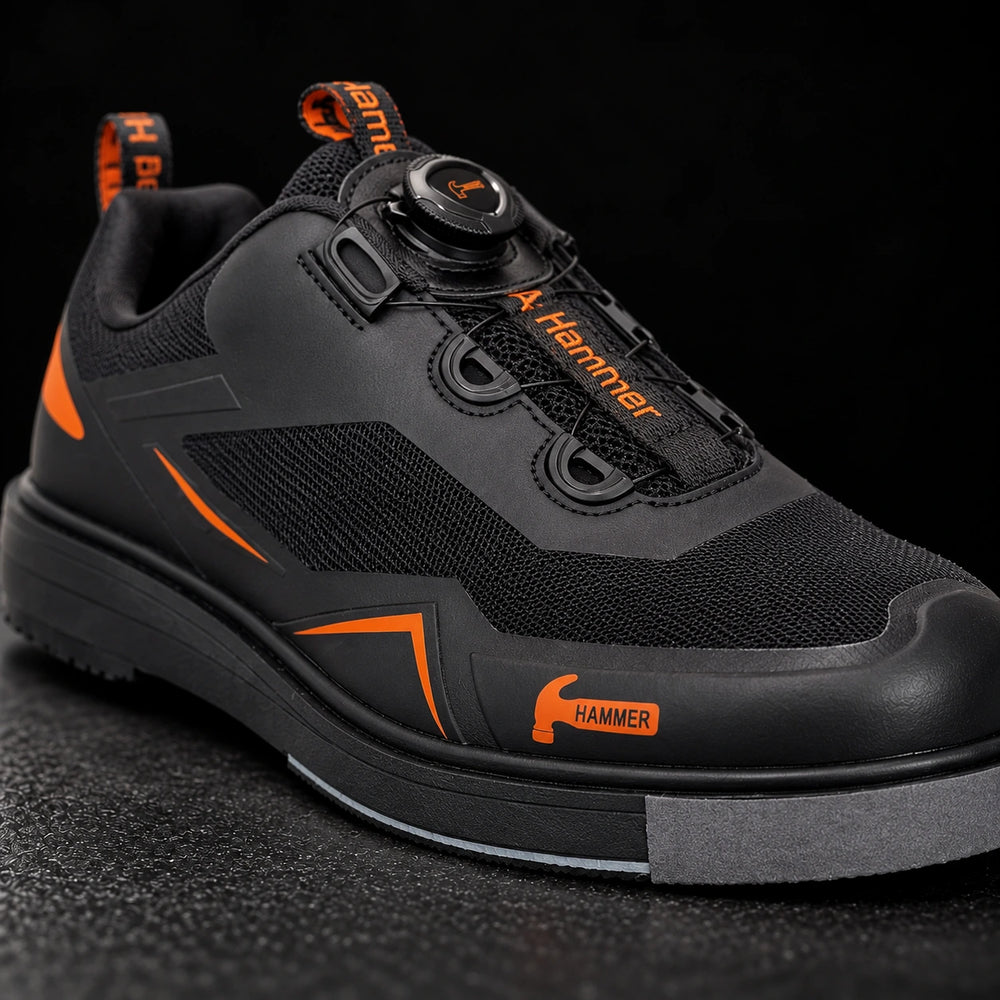 Hammer Vibe noir/orange droitier — vue avant trois-quarts studio premium