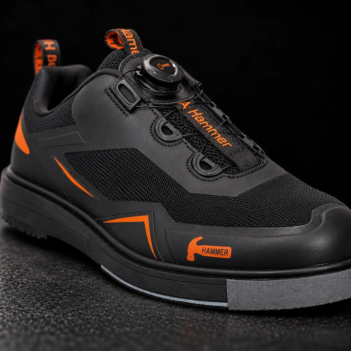 Hammer Vibe noir/orange droitier — vue avant trois-quarts studio premium