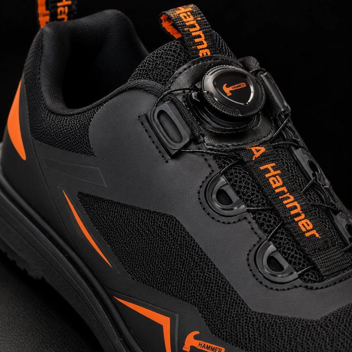 Hammer Vibe noir/orange — détail du serrage à molette et de la languette